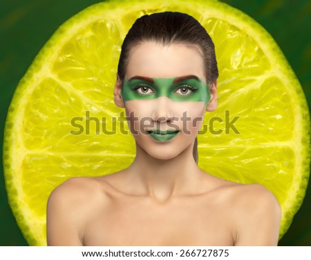 girl lime. girl in the image of the fruit, make-up on her face and heel lemon