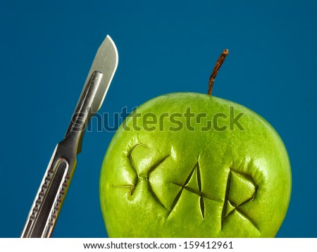 Green apple with Scar and scalpel. Failure plastic surgery. Removal of scars. Recovery after surgery. Unprofessional surgeon. Medical concept.