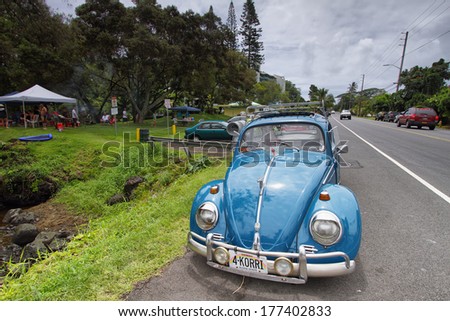 HILO, HAWAII - JUNE  19: Volkswagen retro vintage car near Richardson ocean park on Sunday June 19, 2011 in Hilo, Hawaii. People is doing picnic on Sundays in this area and is common spot classic cars