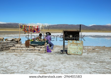 SALINAS GRANDES, ARGENTINA - APRIL 5: Indigenous women in a stall selling souvenirs on April 5, 2015 in Salinas grandes, Jujuy province, Argentina