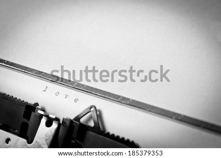 A closeup of an old fashioned typewriter with the words \