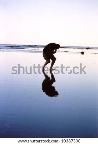 Reflection man 4, on beach