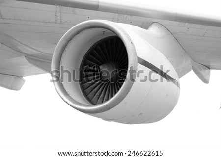 Turbo-jet engine under the white wing of large airplane