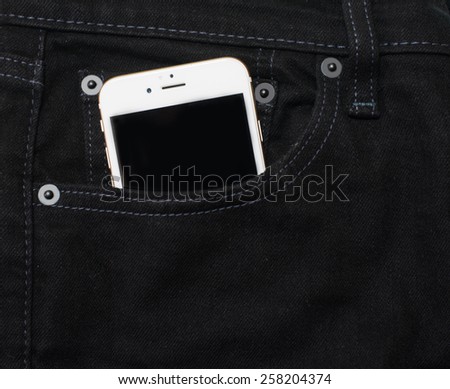mobile phone in pocket black jean