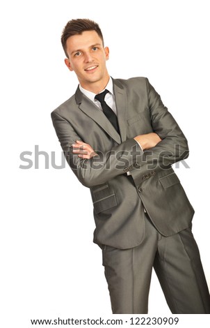 Cheerful corporate man standing with arms folded isolated on white background