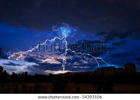Lightning and storm clouds over the city evening