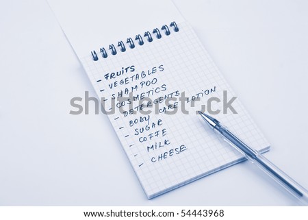 Shopping list handwritten with blue pen in a notebook