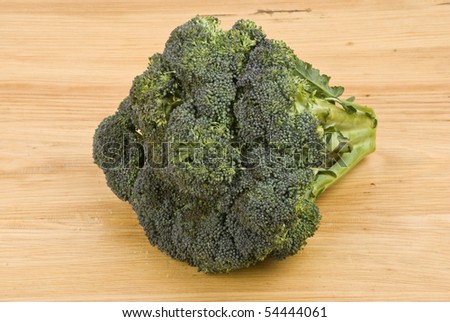 Close up of fresh broccoli isolated  on wood table
