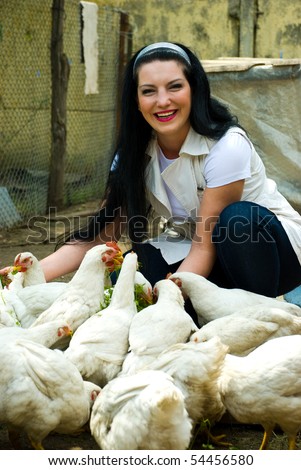 ... hole right through the middle of it. One can almost imagine using it as ... stock photo laughing woman feeding big farm chickens and having fun 54456580 ... hole right through the middle of it. One can almost imagine using it as ...