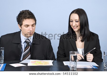 Two young business people having a meeting in office