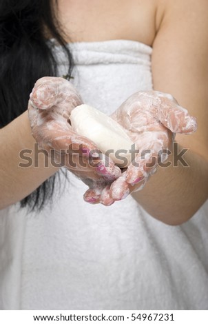 Close up of woman washing hands with soap in front of camera,selective focus on hands