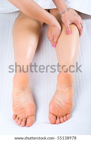 Close up of woman getting legs massage at spa center