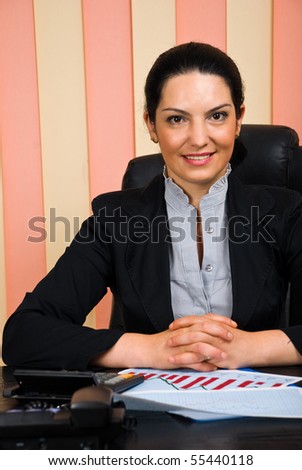 Part of business woman  smiling and sitting at desktop in office,copy space for text message in left part of image