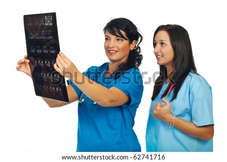 Doctors women smiling and reviewing a resonance magnetic imaging isolated on white background