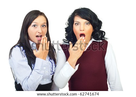 Shocked two women holding hands to open mouth isolated on white background