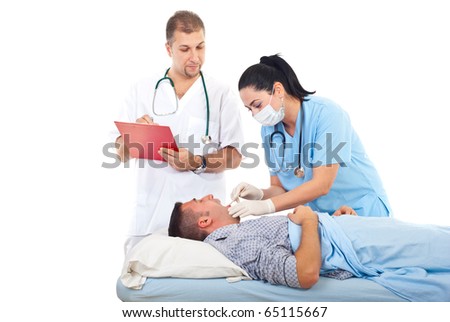 Doctor woman check for sore throat male patient in hospital bed while other doctor writing in clipboard isolated on white background,copy space for text message in left part of image