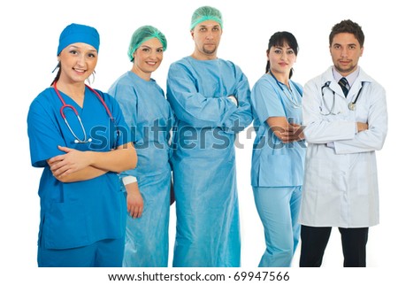 Hospital doctor woman in uniform standing with arms folded in fornt of her team of different doctors