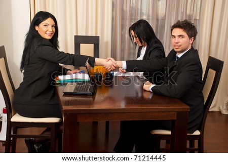 Successful job interview manager woman giving handshake with the new employee man