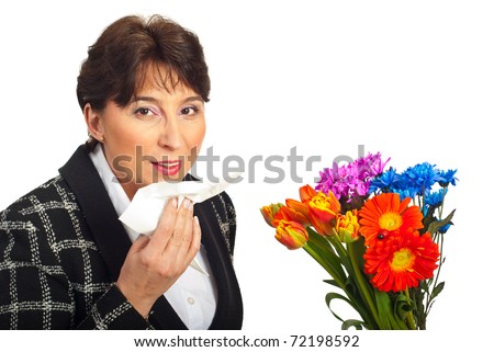 Mature woman prepare to  sneeze because of spring flowers allergy isolated on white background