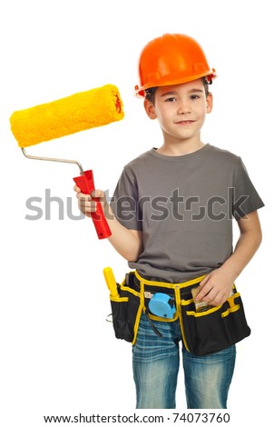 Happy kid boy with helmet holding paint roller isolated on white background