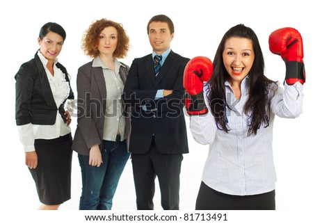 Cheering leader woman wearing boxing gloves and standing in front of her team of business people isolated on white background
