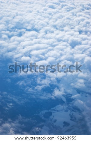 View from above of earth through clouds