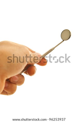 Hand holding mirror dental tool isolated on white background