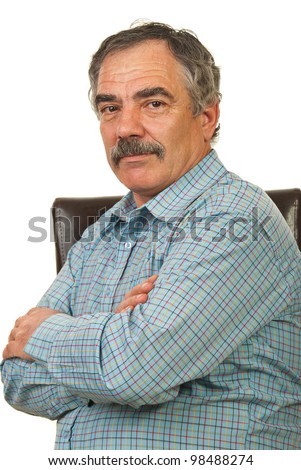 Mature manager man sitting on chair with arms folded isolated on white background
