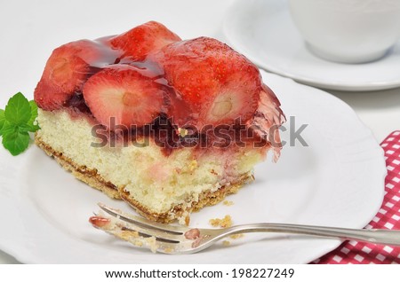 A Piece of Strawberry Pie, missing Bite, on Plate, close up / Strawberry Pie, missing Bite