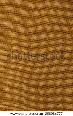 close up of a rust colored knitted background pattern, knitted right, detail, vertical / Rust colored knitted Background Pattern