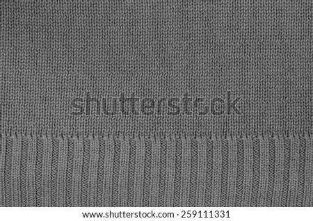 close up of a gray knitted background pattern, knitted right and left, macro, detail, full frame, empty, blank / Gray knitted Background Pattern, Detail