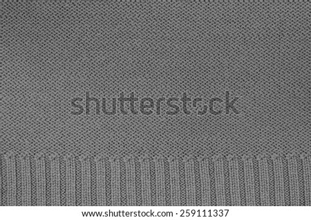 close  up of a gray knitted background pattern, knitted left  and right, macro, detail, full frame, blank, empty / Gray knitted Background Pattern, Detail
