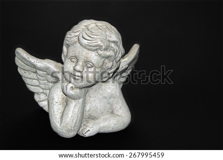 gypsum sculpture of an angel on black, close up, macro, detail, full frame / Dreaming Angel