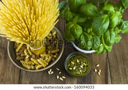 Pasta with basil pesto, pine nuts, basil bunch