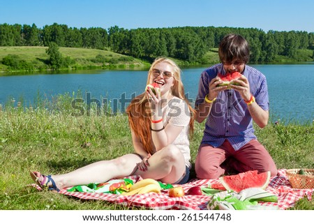 outdoor portrait of happy loving couple at the lake, which is ea