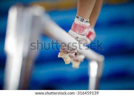 Hands on the gymnastic bars
