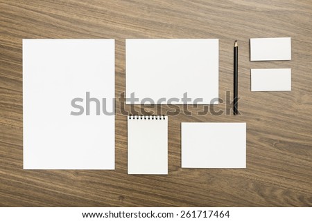 Set. Blank stationery set on wood background / a4 paper, business cards, letterheads, booklet, notepad and pen