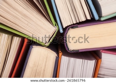 Aged. Old and used hardback books or text books seen from above. Books and reading are essential for self improvement, gaining knowledge and success in our careers, business and personal lives