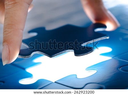 Answer. Missing jigsaw puzzle piece with light glow, business concept for completing the final puzzle piece