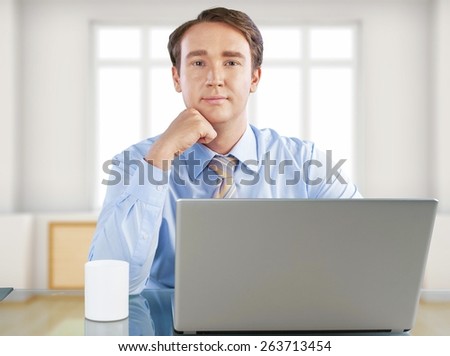 Computer. Young man at work