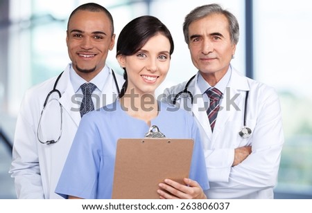 Doctor. Portrait of successful doctors standing together and smiling