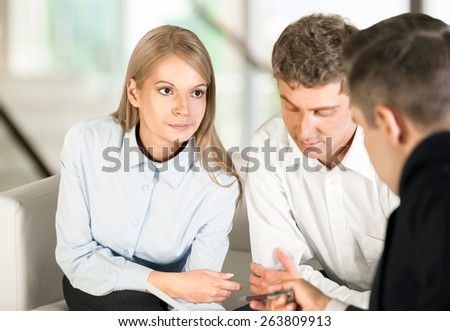 Finance. Financial Planning - Couple getting consulted