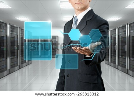 Data. Business man hold the digital earth in data center room : Elements of this image furnished by NASA