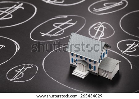 Taxes. House bubble boom presentation on chalkboard. Concept photo of Real estate market bubble , booming, money,price, rent, grid, home, house, housing, industry and subprime mortgage crisis. (Copy