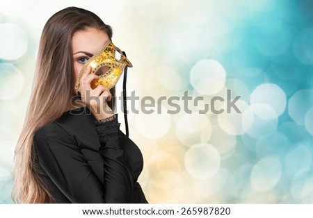 Art. Beauty Model Girl with Carnival Mask.Masquerade Woman.Holiday Dress and Makeup. Fashion Brunette Portrait