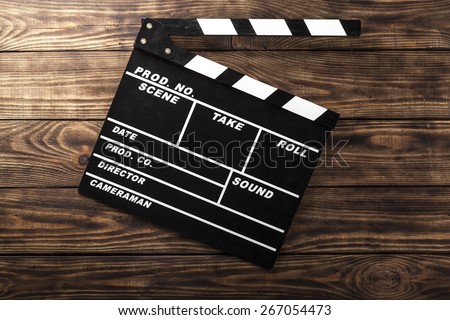 Film. Cinema. vintage photo of movie clapper on wood