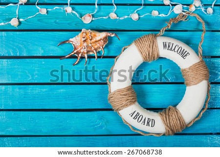 Curriculum. We are hiring ! - Welcome on Board - Lifebuoy with fishnet and blue text on wooden background