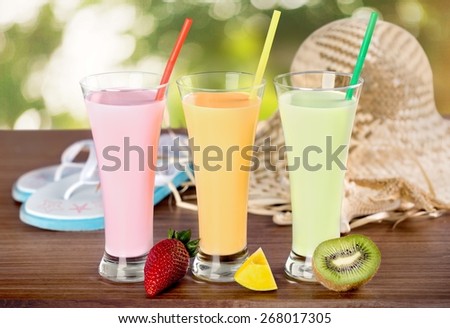 Mango. Strawberry, mango and kiwi soft drink, smoothie, and holiday background