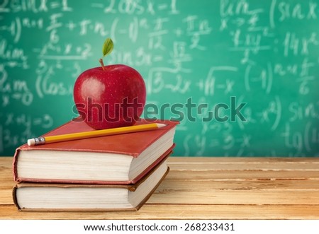 Apple. Education Series (apple and pencil on book)