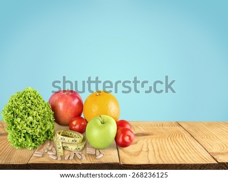 Nutritional Supplement. Fruit , vegetable, supplement and measure tape